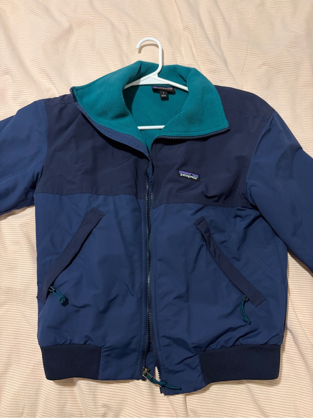 Patagonia Teal Fleece Jacket with Pink Care Tag